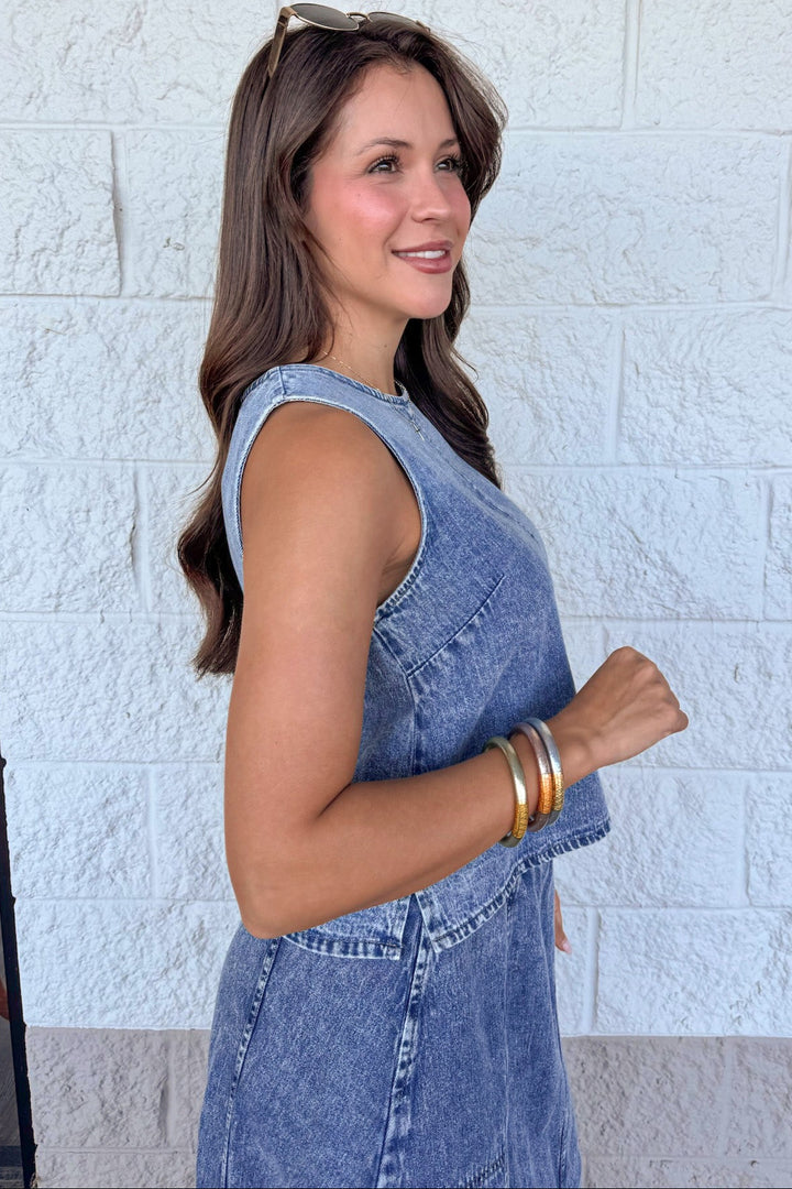 washed blue denim sleeveless crew neckline semi-cropped top with side slits at hem