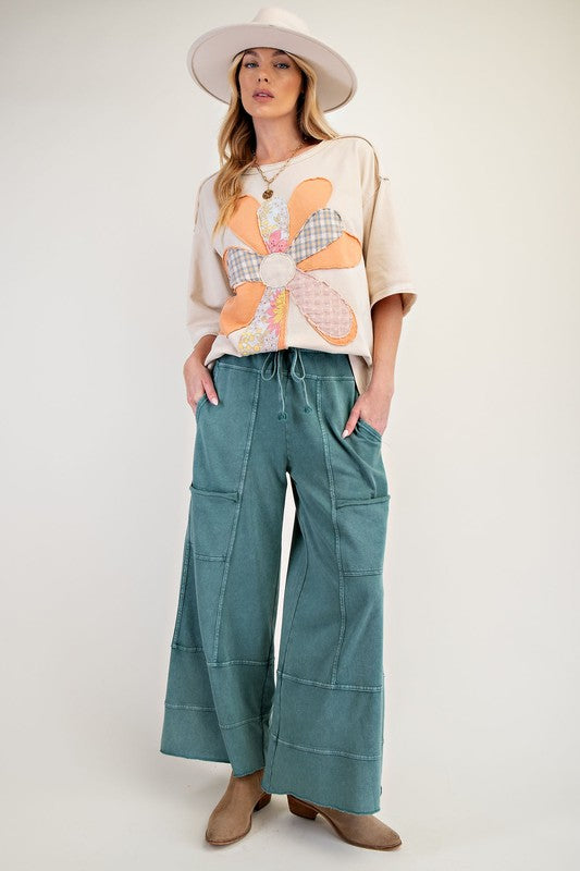 Women's terry knit wide leg pants in mineral washed teal green by Easel showing full front view