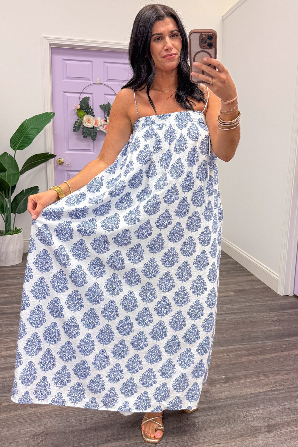 white and blue abstract floral print sleeveless flowy silhouette maxi dress
