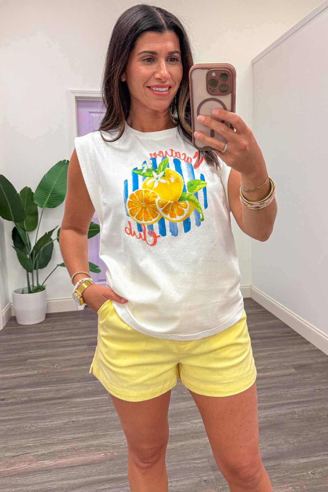 yellow and blue citrus graphic print sleeveless white top