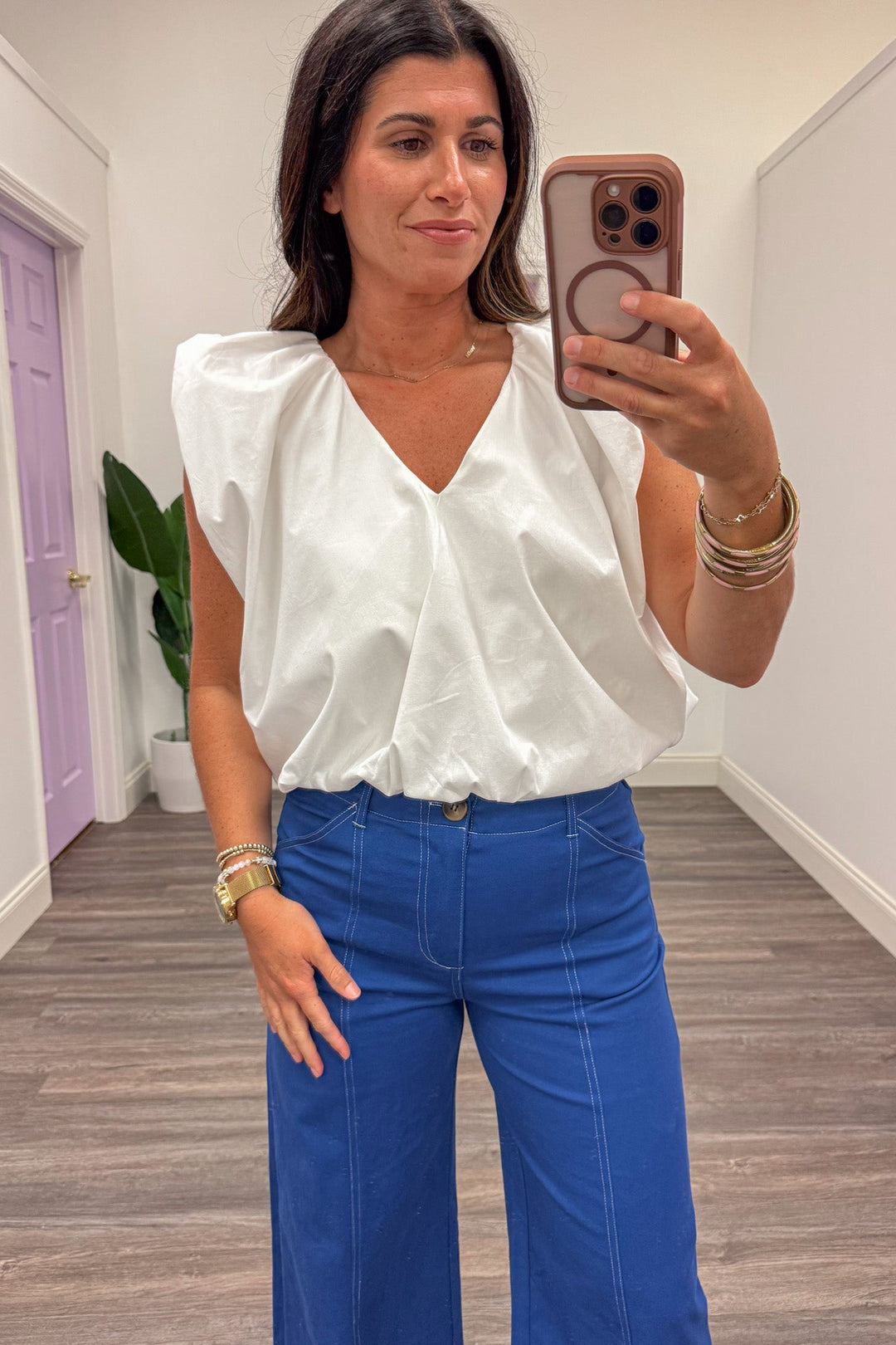 solid white v neckline flutter sleeve bubble hem top