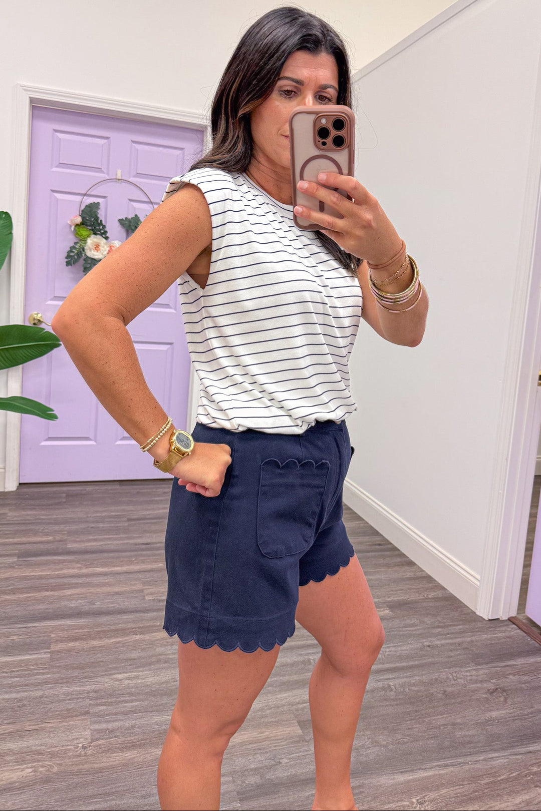 navy and white horizontal striped sleeveless crew neckline top