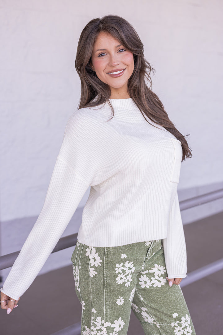 Women's cream soft ribbed knit mock neck sweater by Blu Pepper showing slight side view