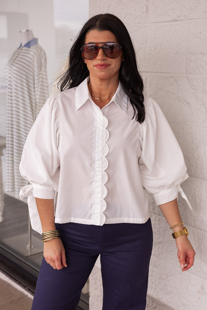 Women's white button up shirt with scallop detailing