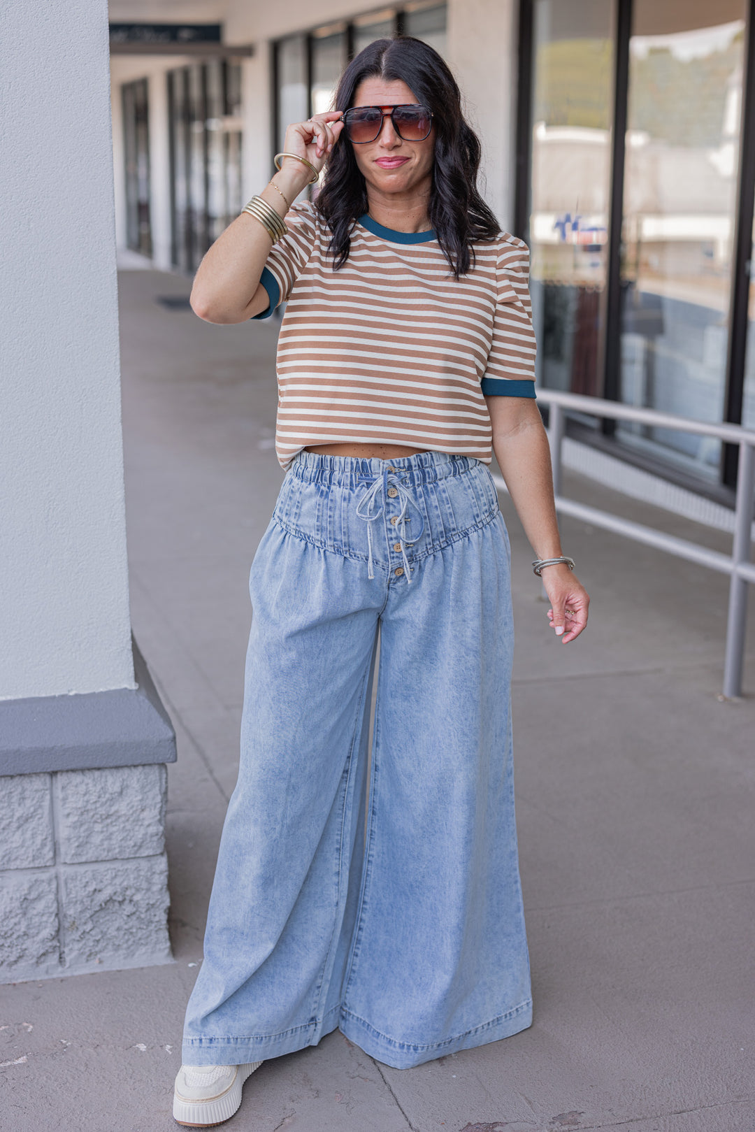 Palazzo style wide leg light blue washed denim pants with button fly by ee:some, perfect for fall