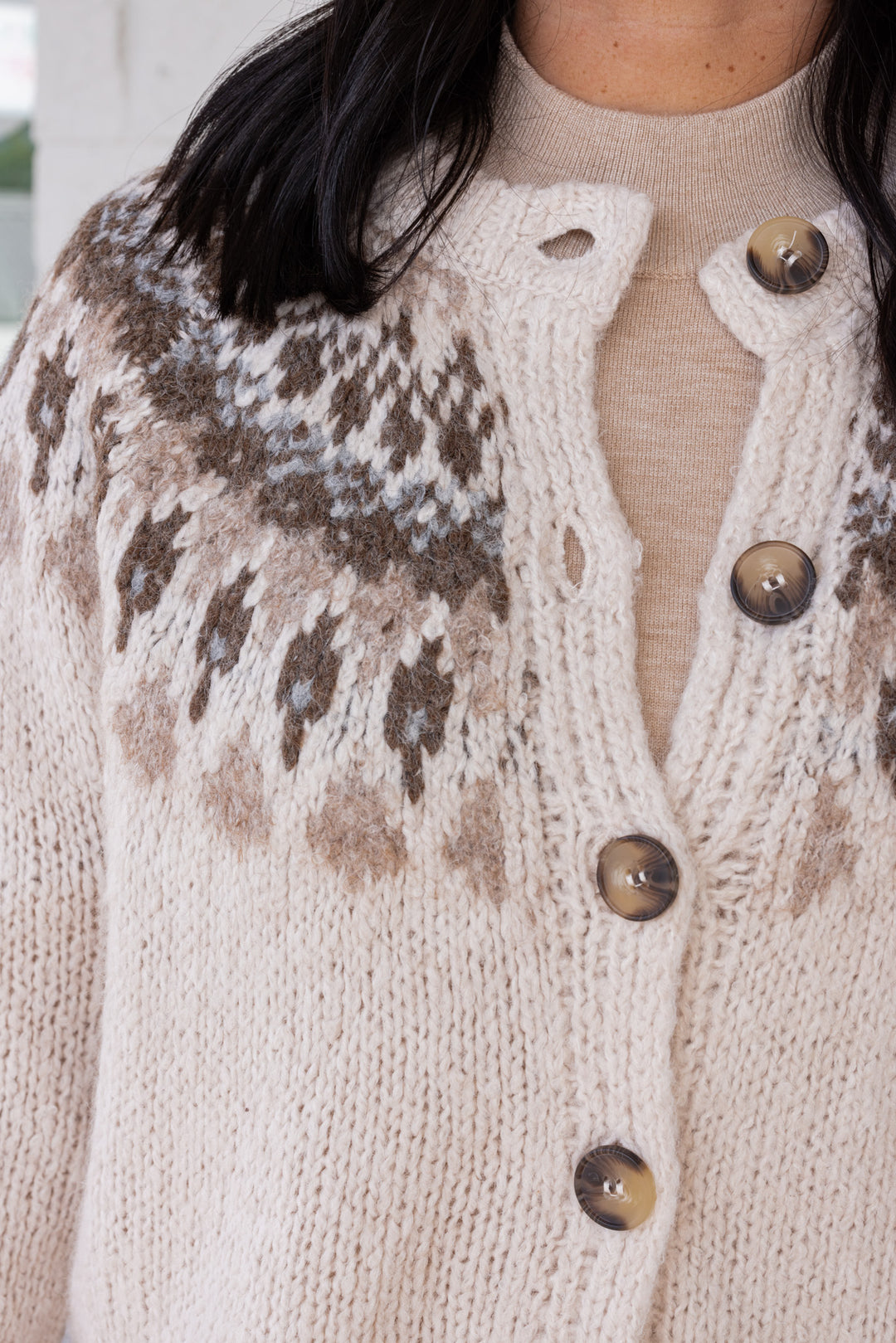 Women's Ivory button front sweater cardigan with print around the shoulders by Blu Pepper showing button front closures on bodice