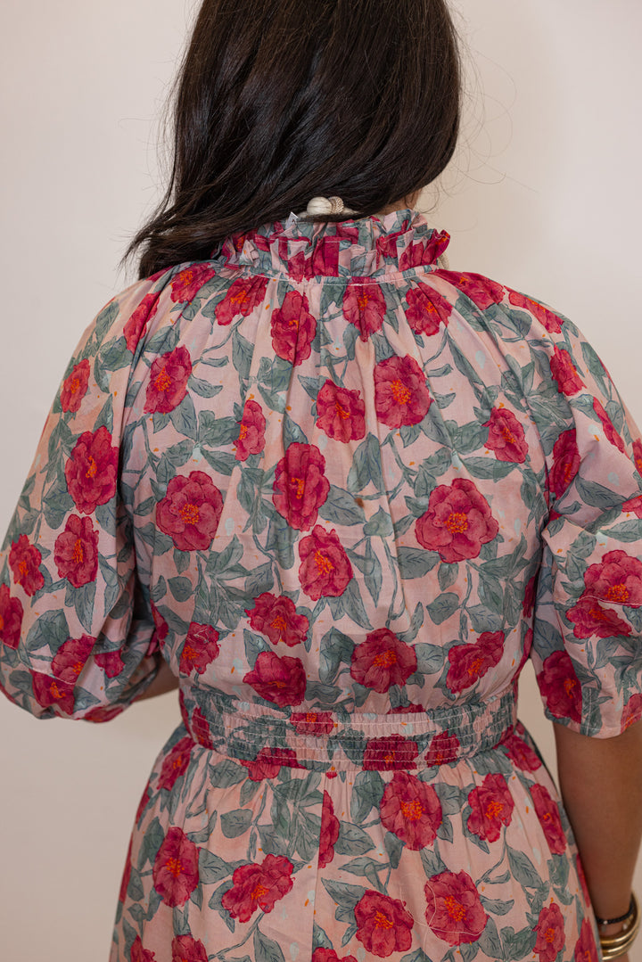 Women's pink and green floral maxi dress with puff sleeves and ruffle detail by Entro showing up close back view