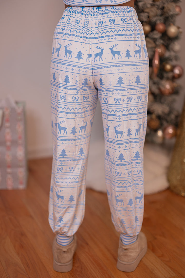 Women's white and light blue Christmas Winter print fleece pajama jogger pants by Peach Love California showing up close back view