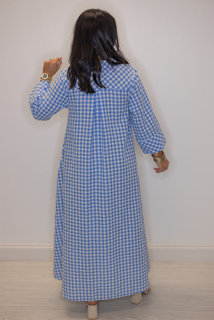 Women's blue and white gingham midi dress by Entro showing back pleated details