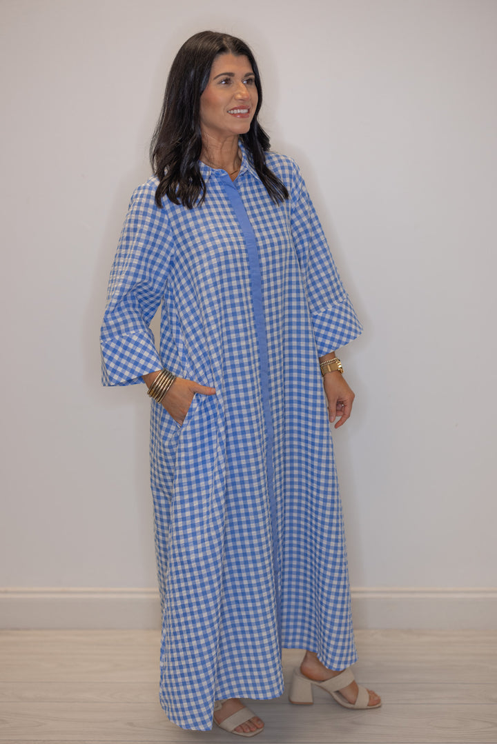 Women's blue and white gingham midi dress with hidden button front by Entro showing side pockets