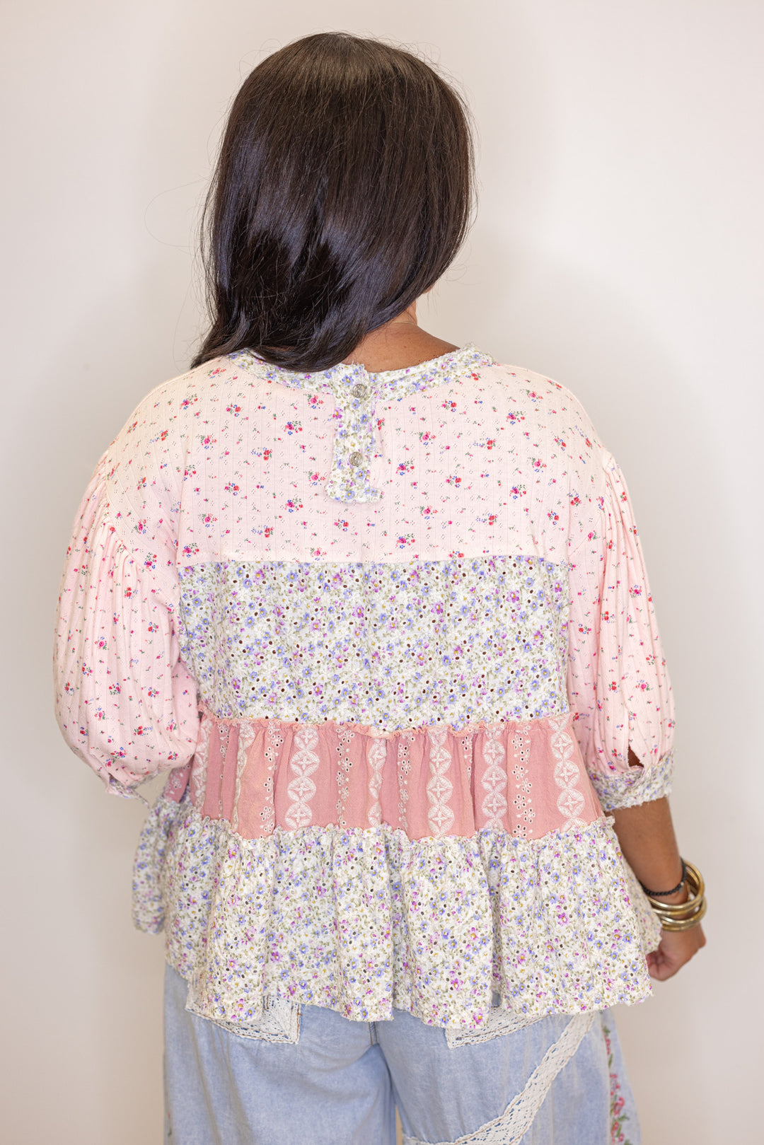 Women's pink and ivory floral patchwork top with embroidery and eyelet details by POL showing up close back view