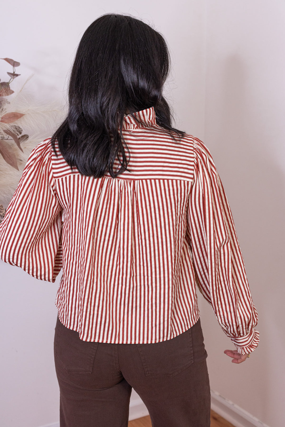 Women's red and cream striped button front top with ruffle trim details by &merci showing up close back view