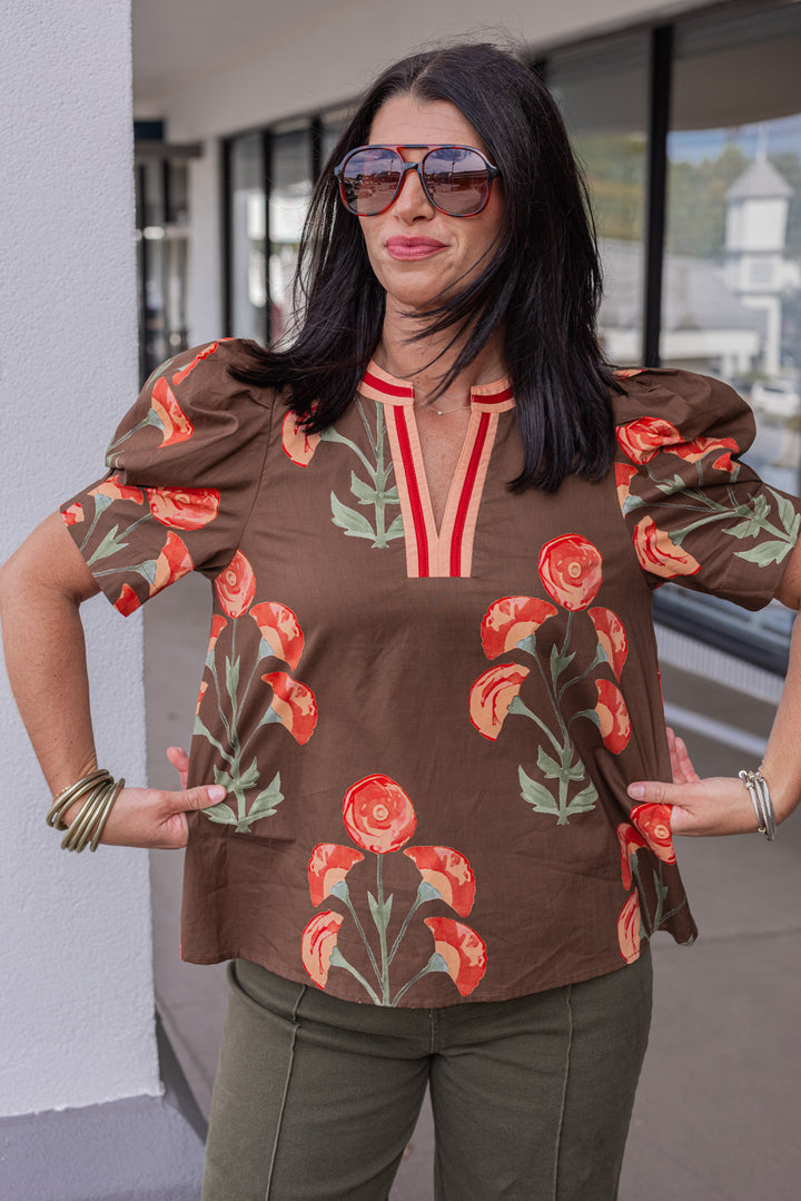 Women's brown poplin top with burgundy, peach and olive green floral print by Entro showing true to size fit