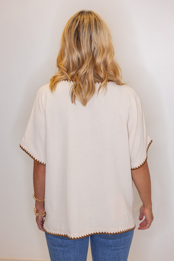 Oatmeal lightweight crinkle top with embroidery stitching trim by Jodifl showing back view