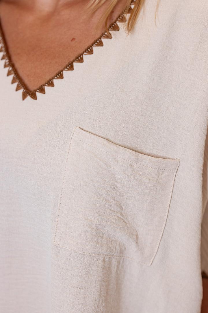 Oatmeal lightweight crinkle top with embroidery stitching trim by Jodifl showing pocket detail