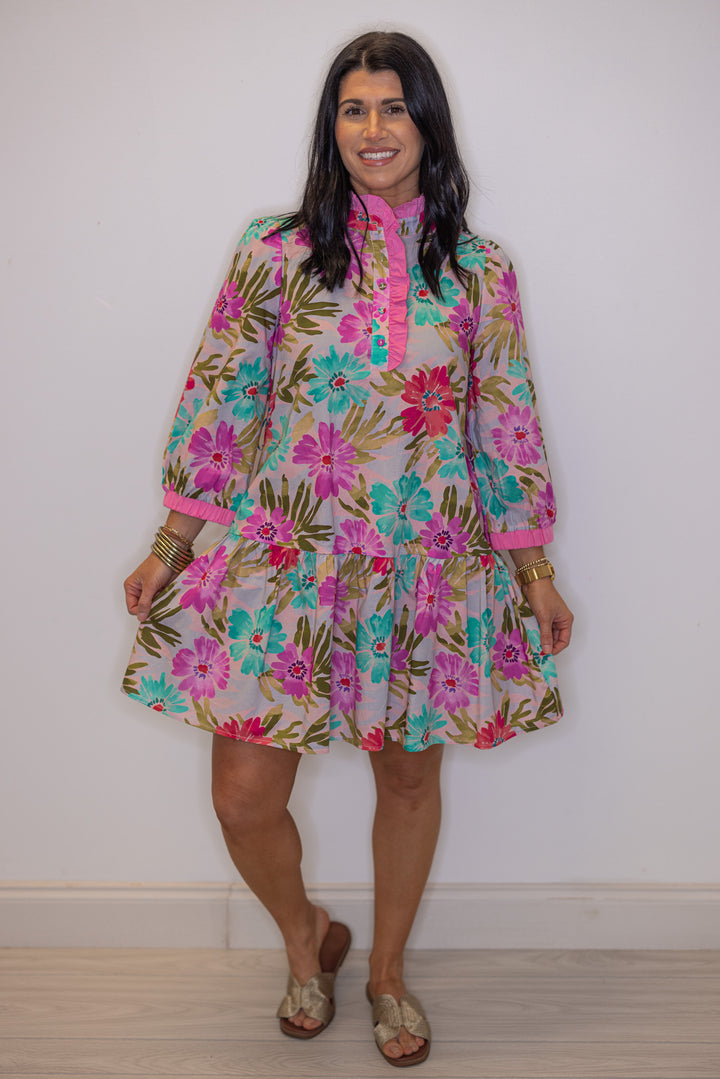 Women's pink multicolor floral print poplin dress by Jodifl showing ruffled tiered bottom hem