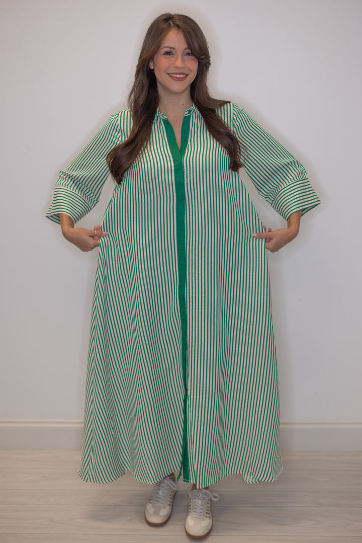 Women's striped green maxi dress by Entro showing flowy skirt