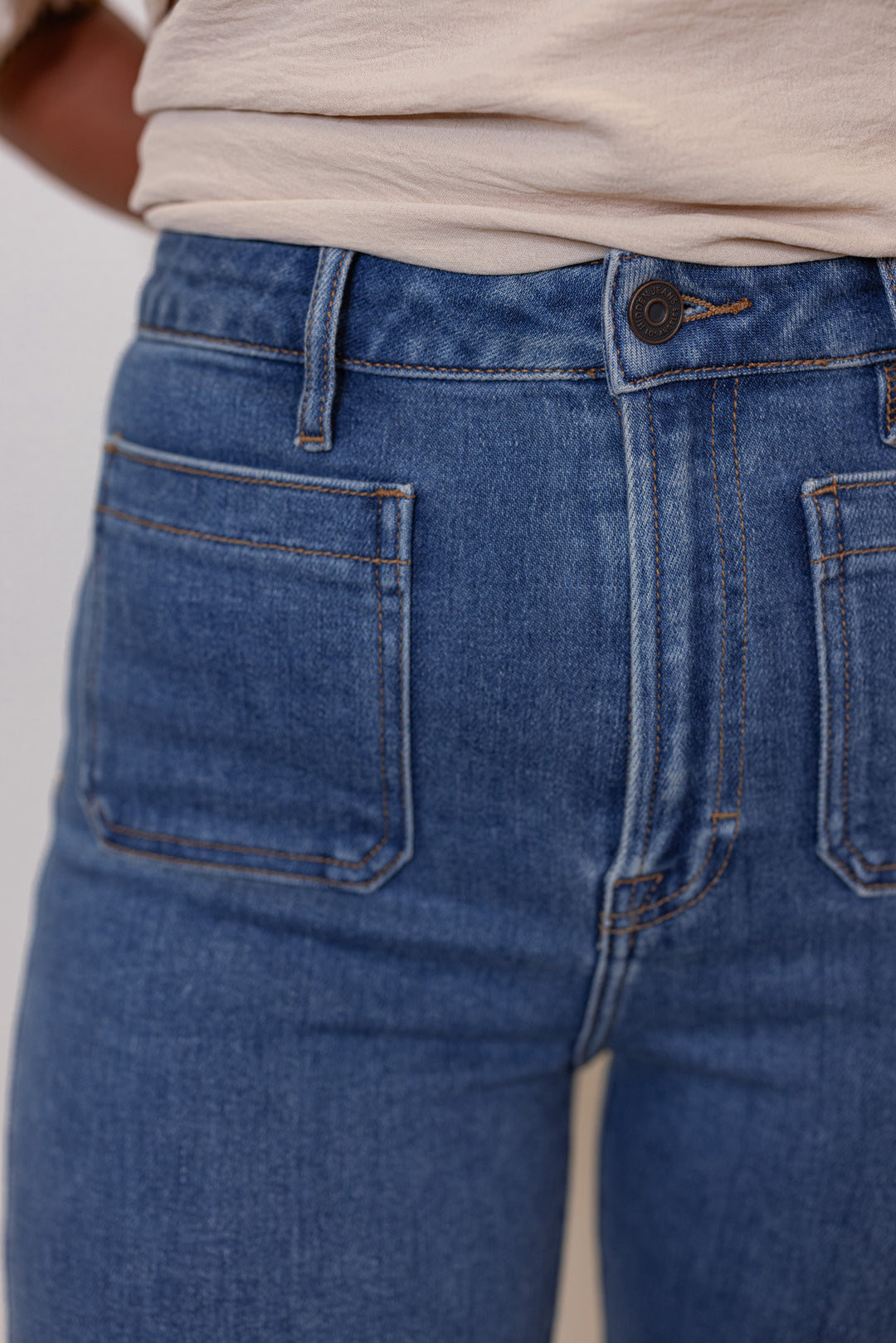 Hidden Jeans Happi crop flare jeans in medium dark denim showing front pocket detail