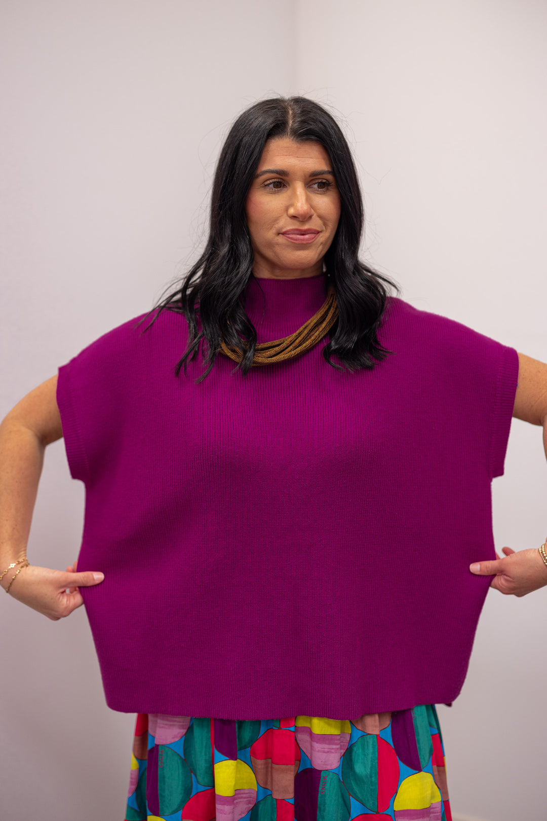 Women's magenta short sleeve mock neck ribbed knit top with drop shoulder by Jodifl showing true to size fit