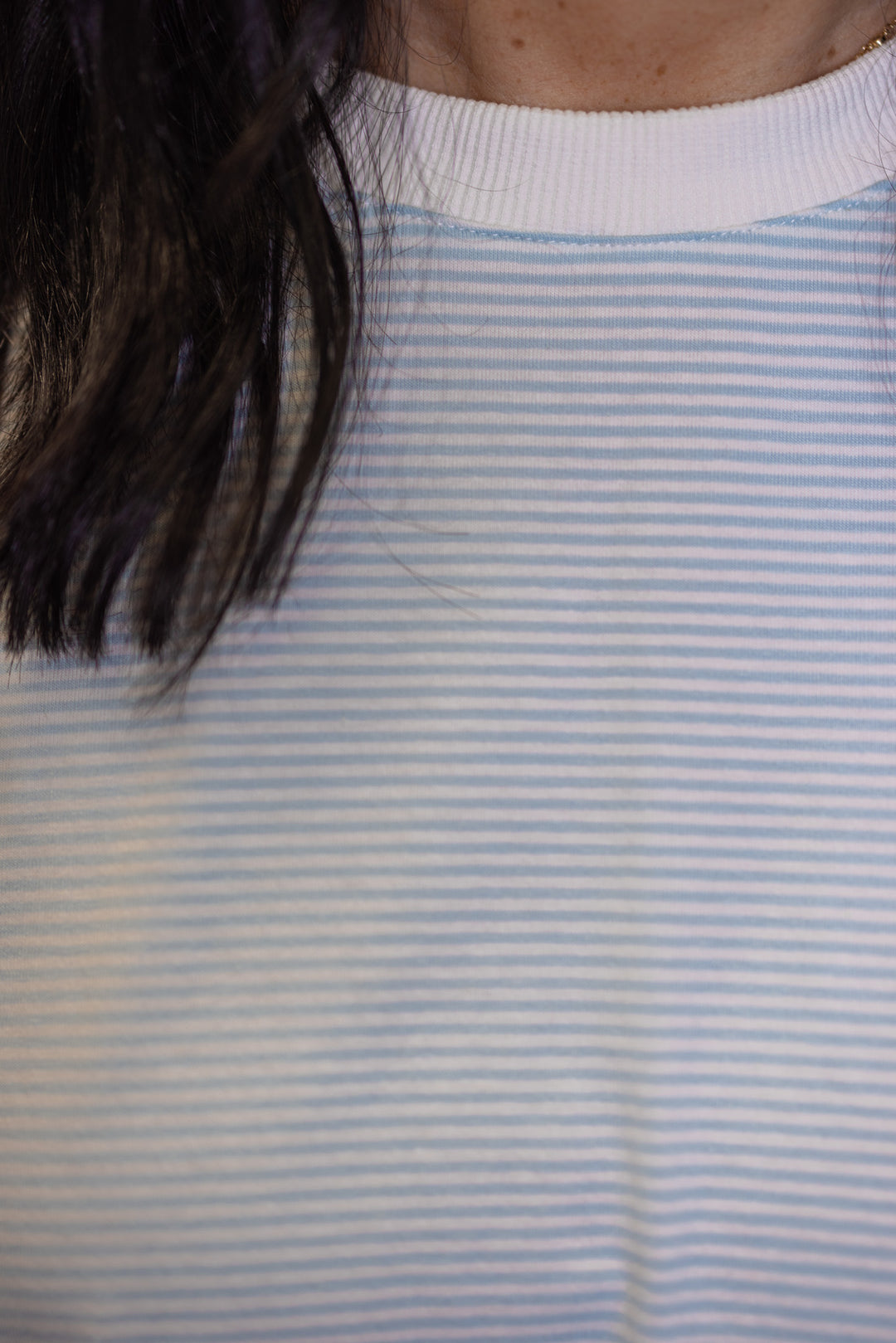 Womens light blue and white knit oversized top with trendy striped pattern