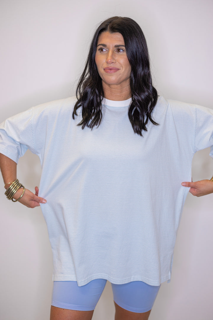 Womens oversized light blue and white striped knit oversized top, perfect to wear with biker shorts