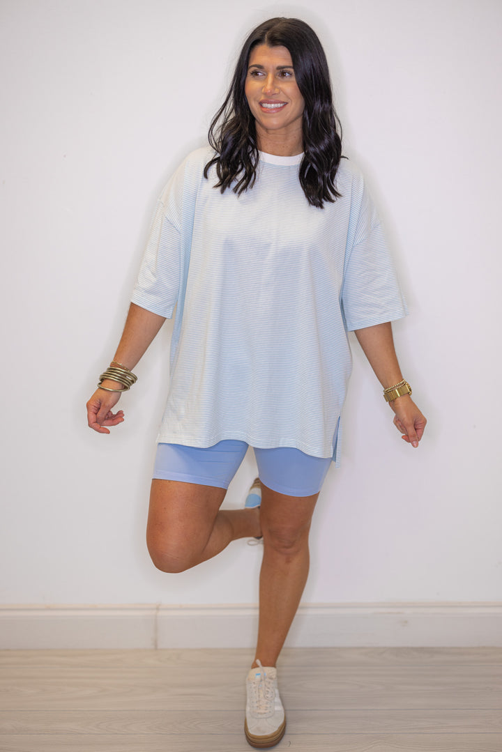 Womens light blue and white striped knit oversized top, perfect for warmer weather