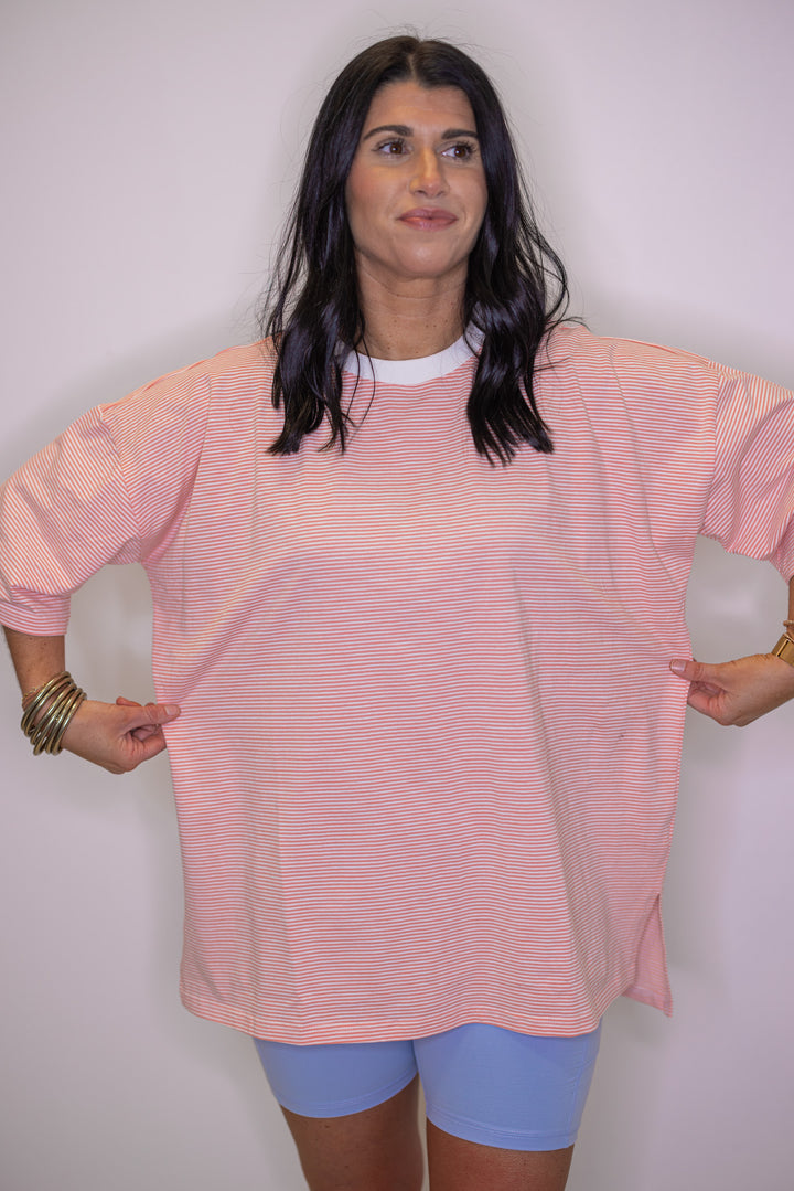 Women's cozy coral and white striped knit oversized top
