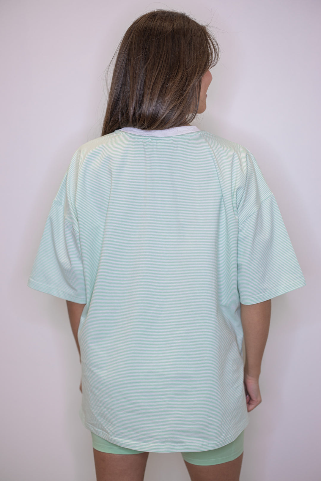 Women's mint green and white striped knit oversized top by Wishlist showing up close back view