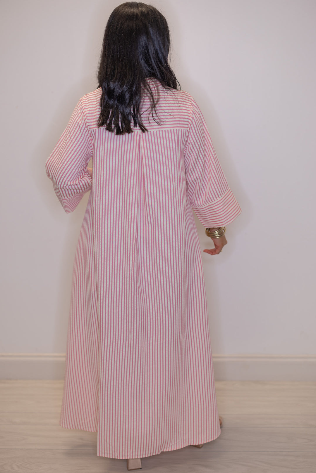 Women's striped light pink maxi dress by Entro showing full back view