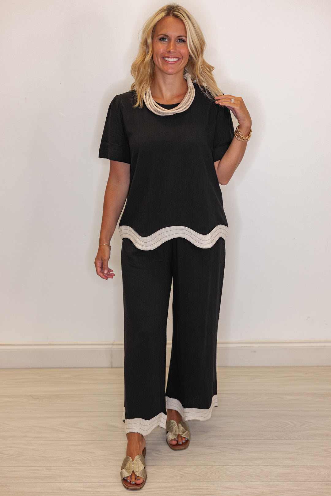 Umgee linen wide leg pants in black with oatmeal scalloped hem by Umgee showing full front view