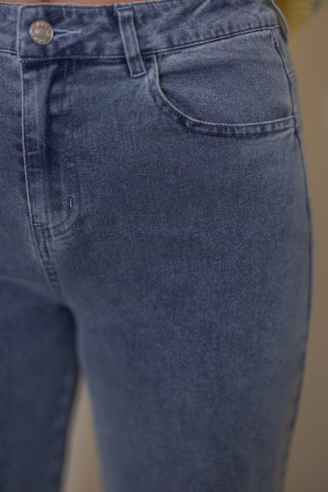 Women's light blue twill denim wide leg pants with ruffle cuffs by Entro showing front pocket details