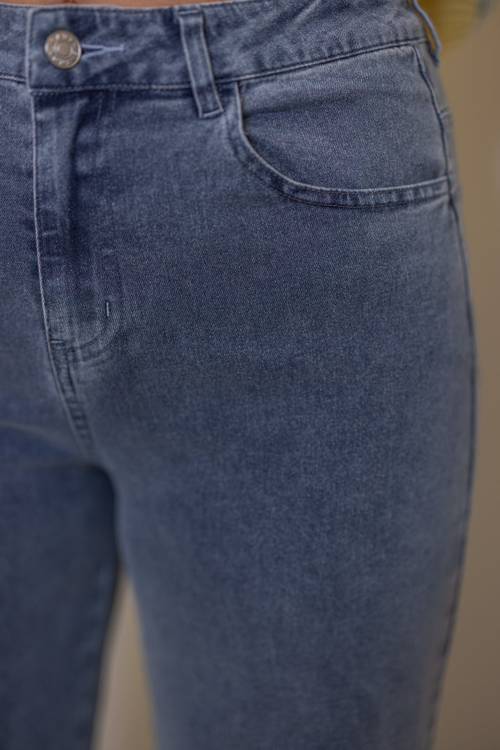 Women's light blue twill denim wide leg pants with ruffle cuffs by Entro showing front pocket details