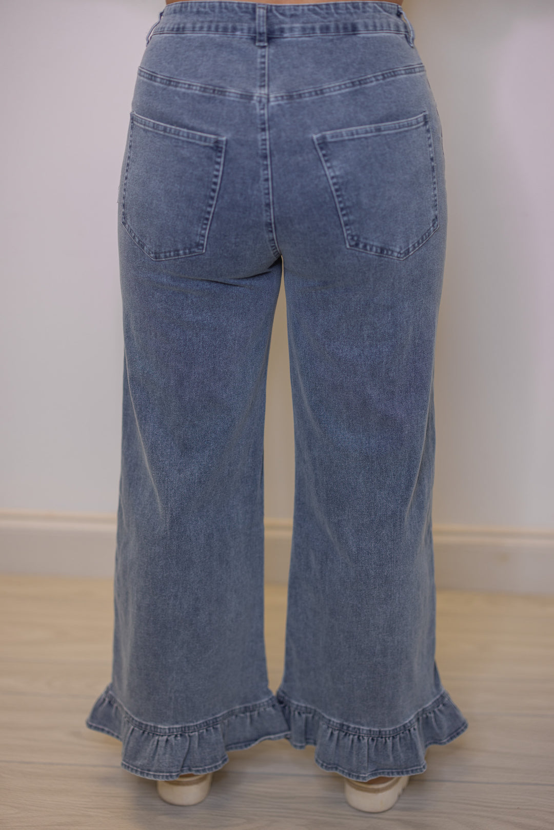 Women's light blue twill denim wide leg pants with ruffle cuffs by Entro