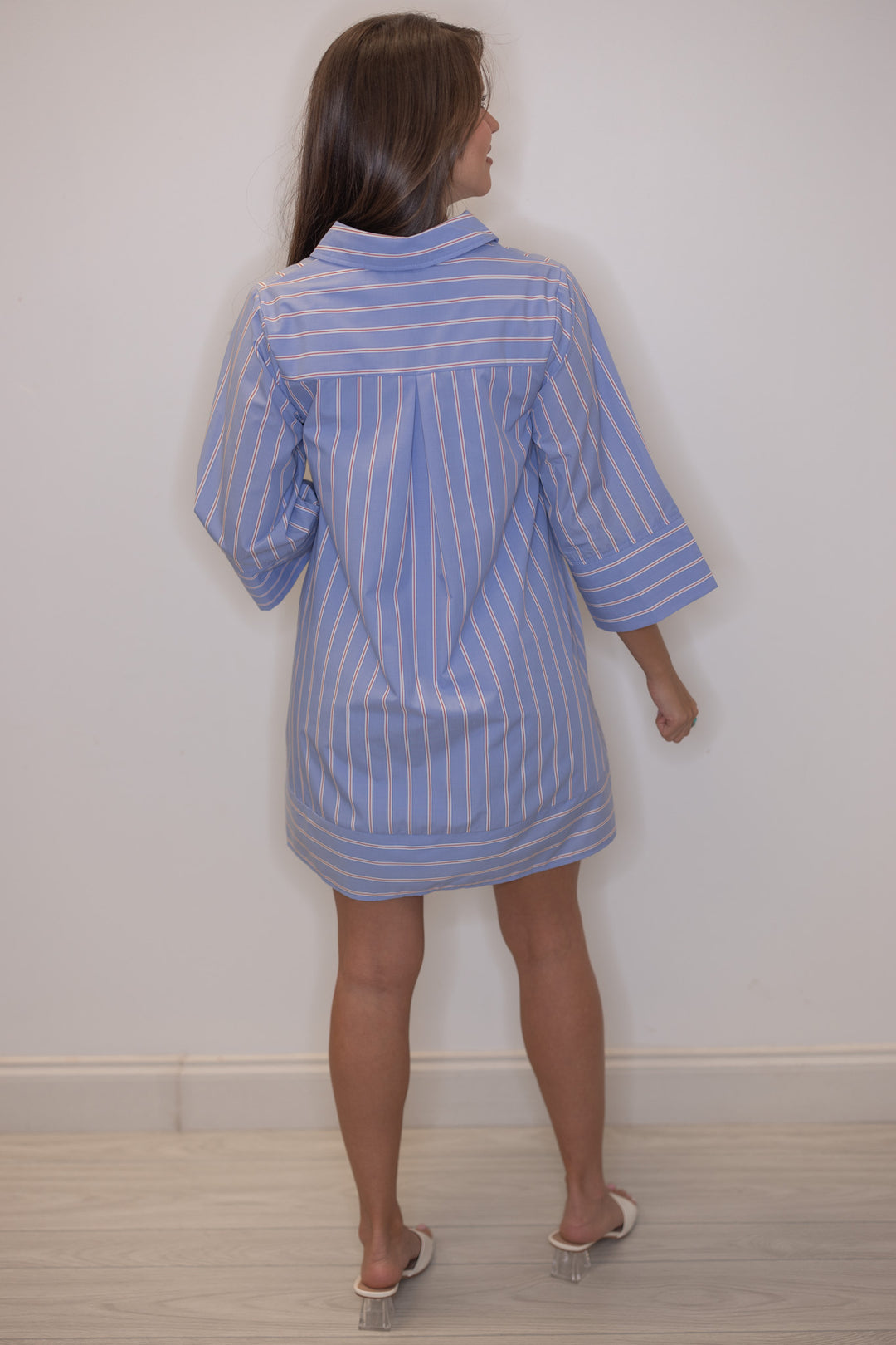 Women's blue, white and red striped dress  by Entro showing pleated details in back 