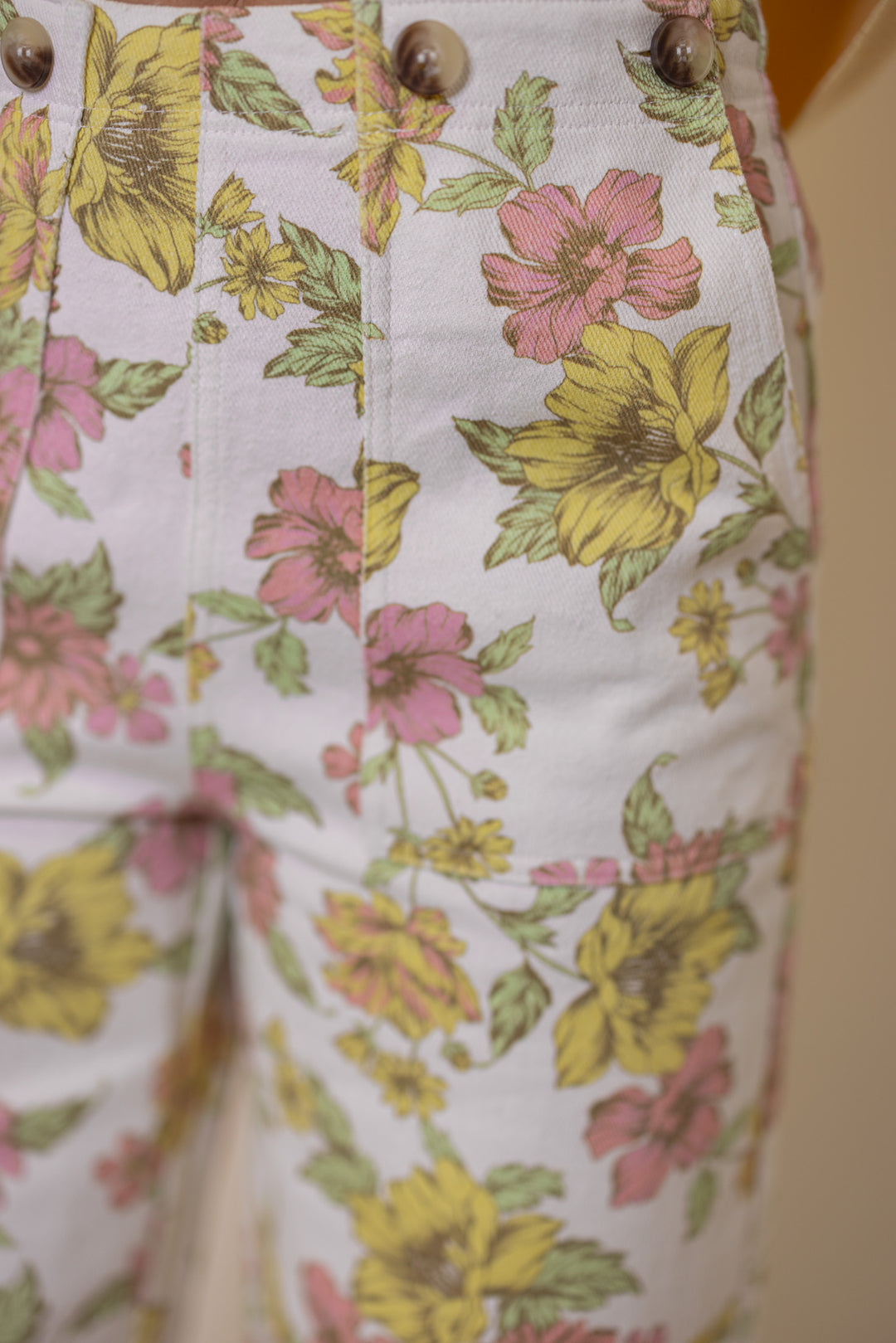 Women's cream twill denim wide leg pants in pink and yellow floral print by Entro showing close look at floral pattern