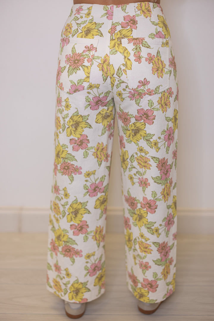 Women's cream twill denim wide leg pants in pink and yellow floral print by Entro showing up close back view