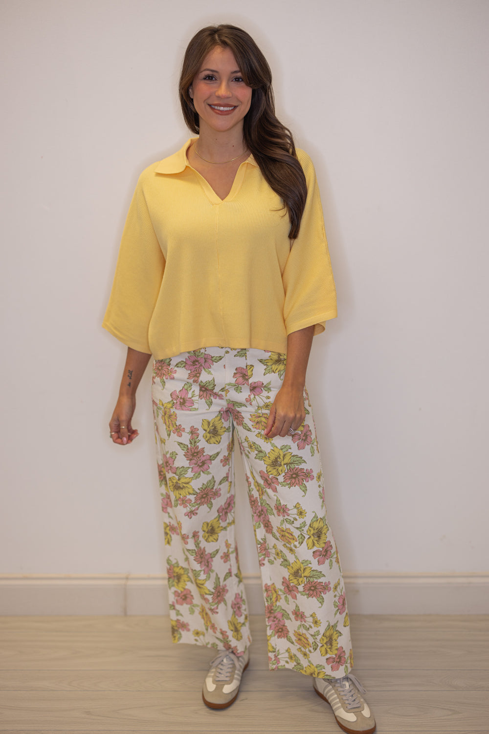 Women's cream twill denim pants by Entro showing pink and yellow floral print details