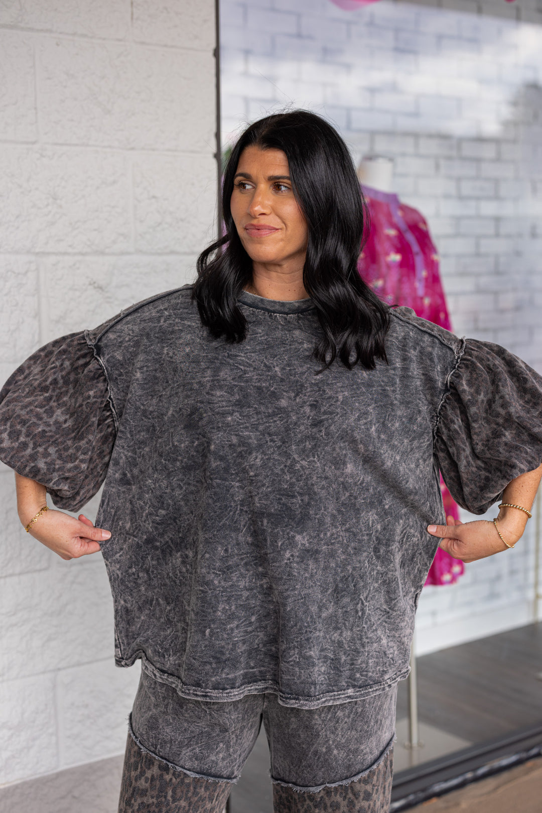 Women's mineral washed ash black knit top with animal print colorblock details by J Her showing true to size fit