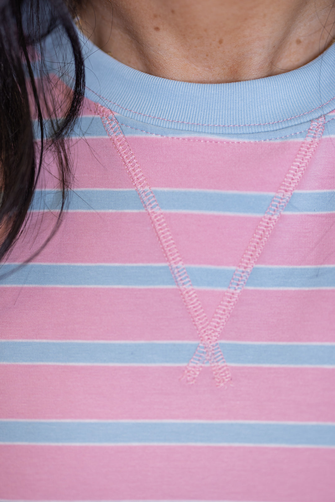 Women's pink and sky blue striped knit top with crew neckline 