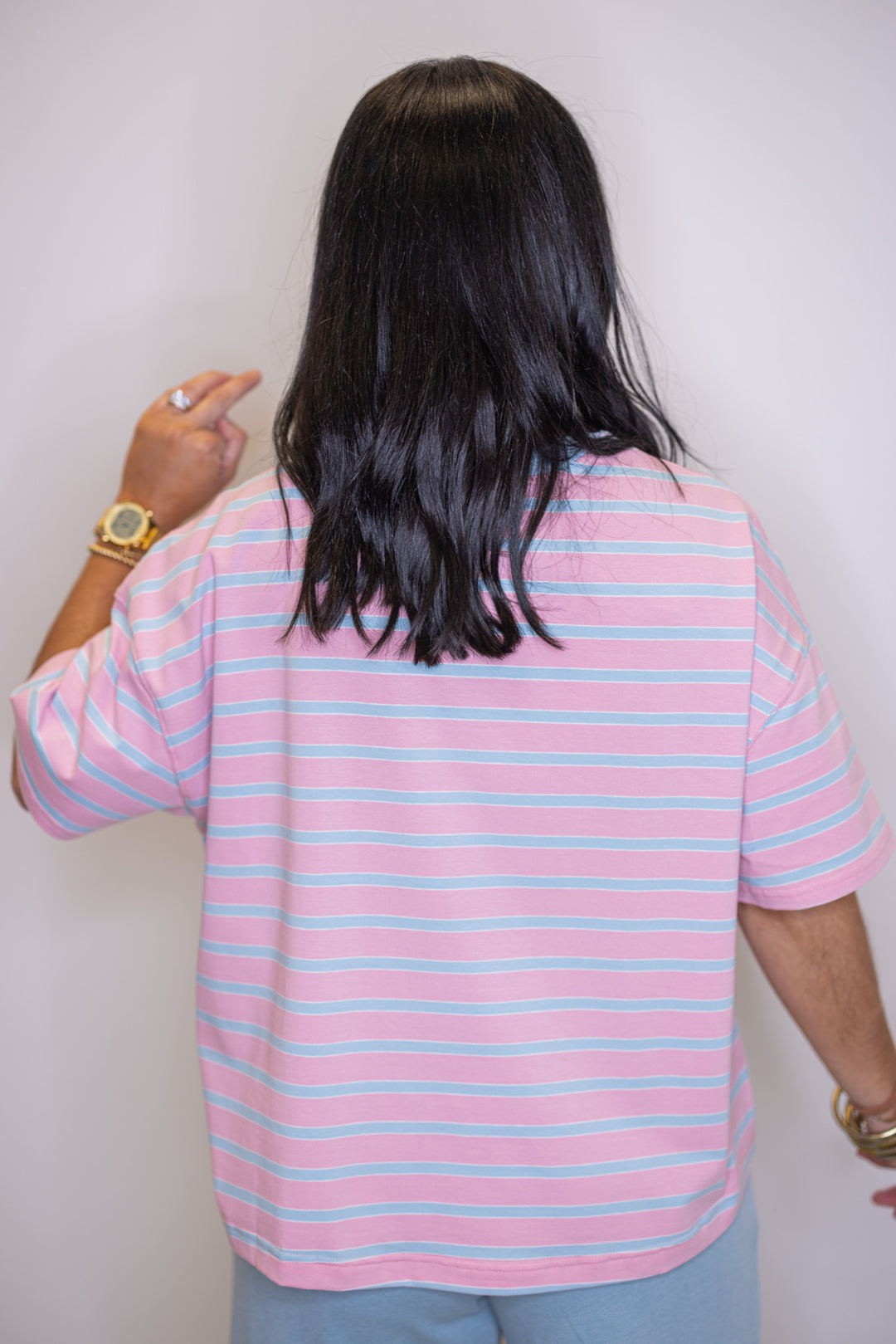 Women's pink and sky blue striped knit top by Wishlist showing up close back view