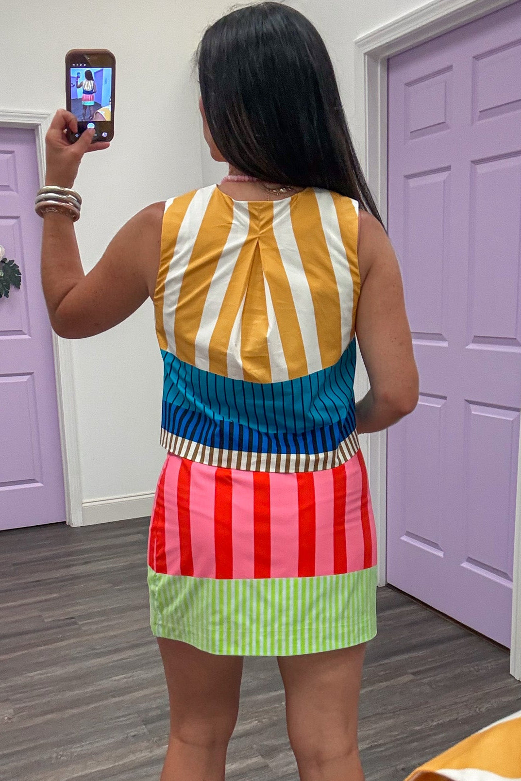 yellow blue teal brown and cream striped button front semi-cropped top with back pleated detail