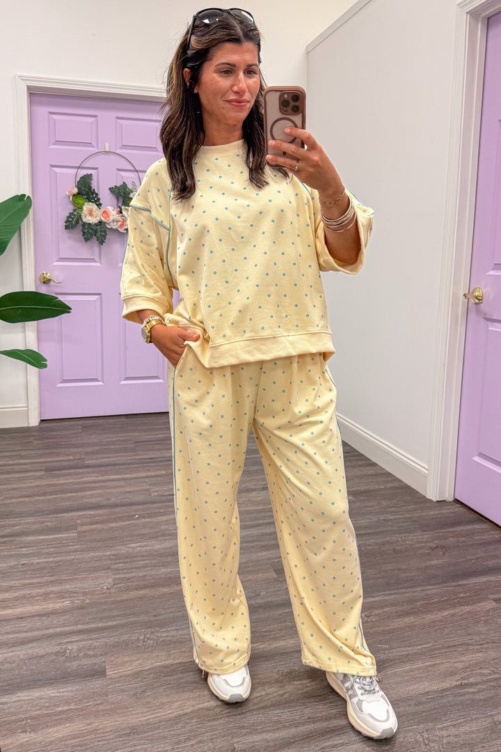 washed butter yellow with light blue polka dots wide leg knit jogger pants with piping details