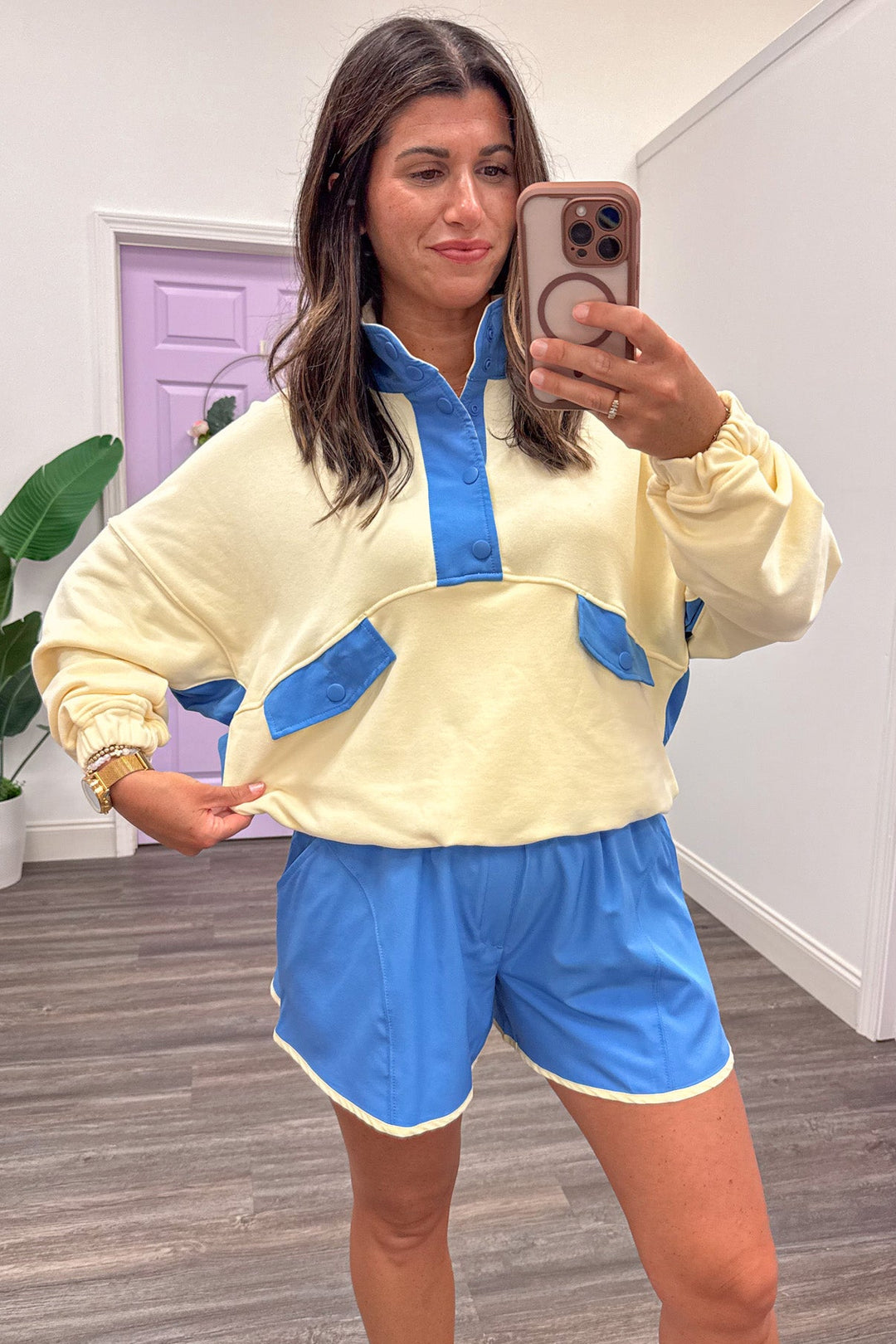 butter yellow with blue colorblock details snap bodice long sleeve relaxed silhouette pullover