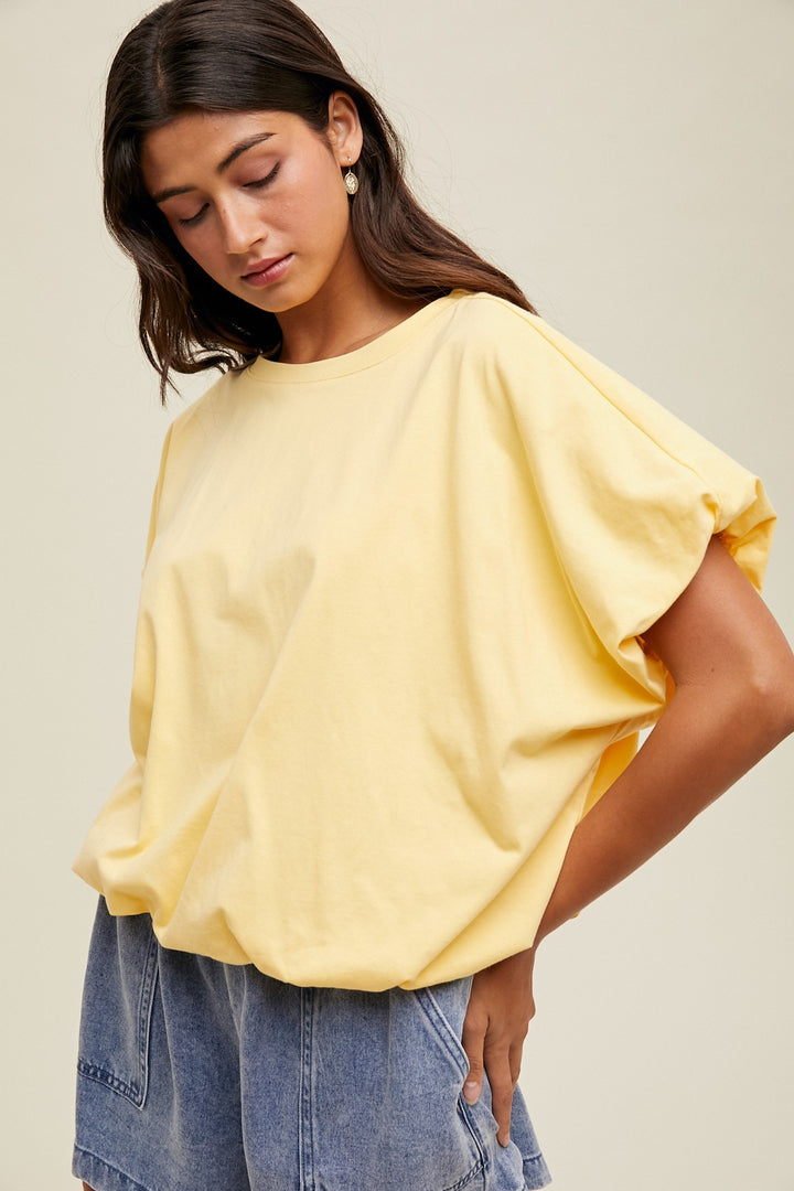 Lemon yellow knit semi-cropped top with bubble hem by Wishlist showing up close, slight side view