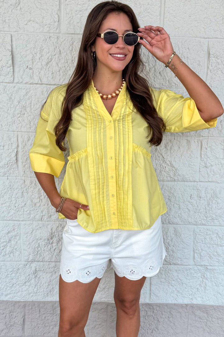 solid yellow ruched pintuck details button front short sleeve v neckline top