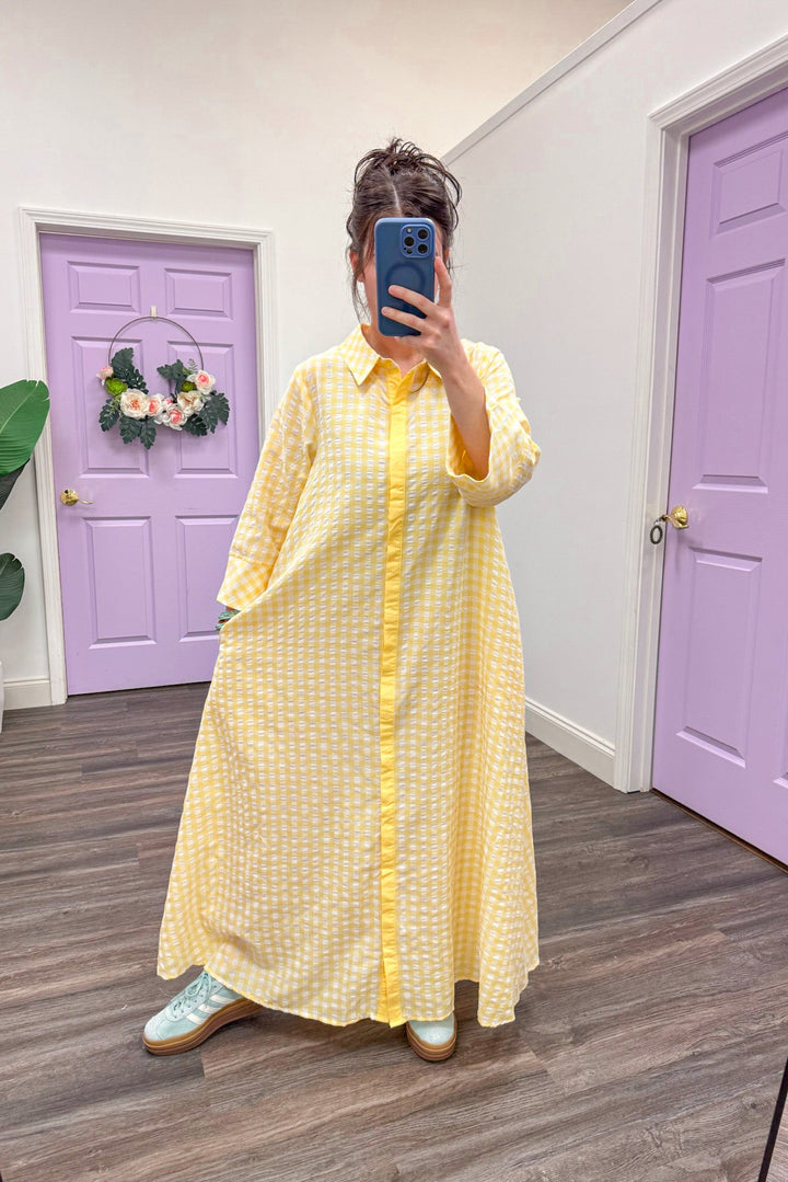 Women's trendy yellow and white gingham midi dress by Entro, perfect for Easter