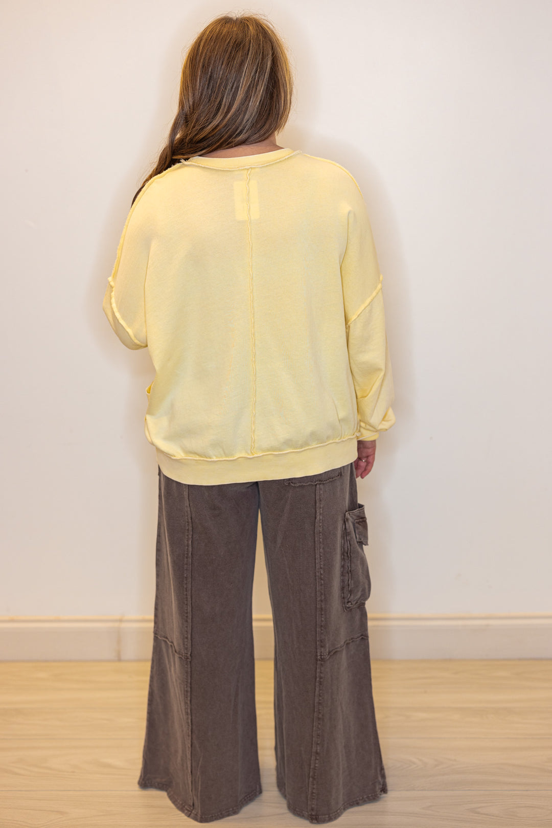 Mineral washed lemon yellow pullover top with front pockets by Easel showing full back view