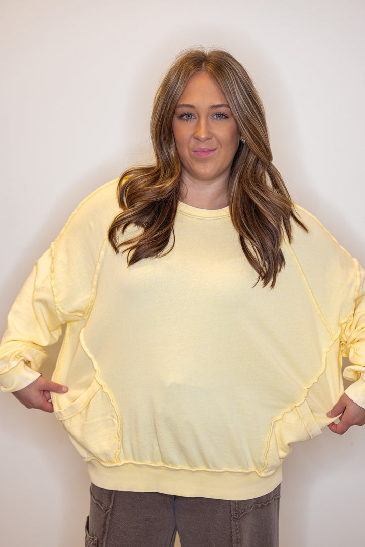 Mineral washed lemon yellow pullover top with front pockets by Easel showing relaxed fit