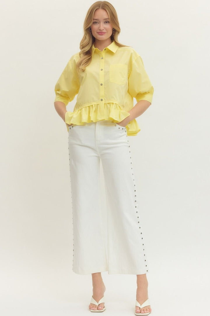 Women's semi-cropped button down yellow peplum top with ruffled hem by Entro showing full front view