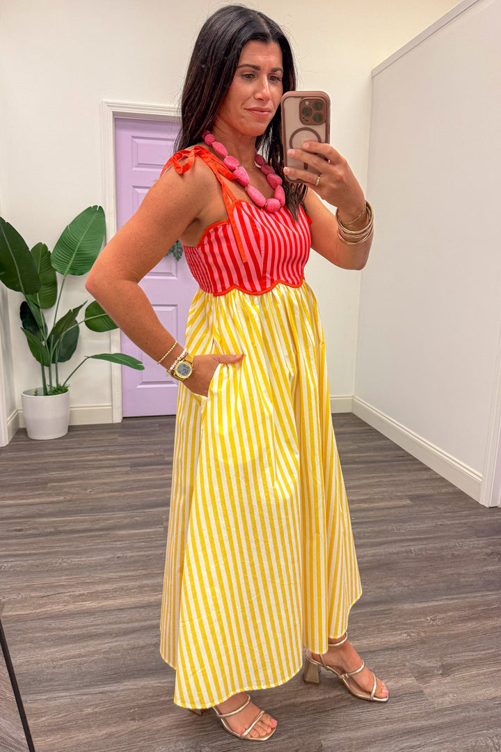 yellow and pink vertical striped sleeveless midi dress with side pockets